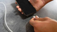 Picture of Why do phones still use battery when powered off?